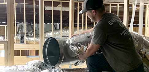 Mr. Comfort of Wright's Air Conditioning as he services and repairs an air conditioner quickly and affordably.